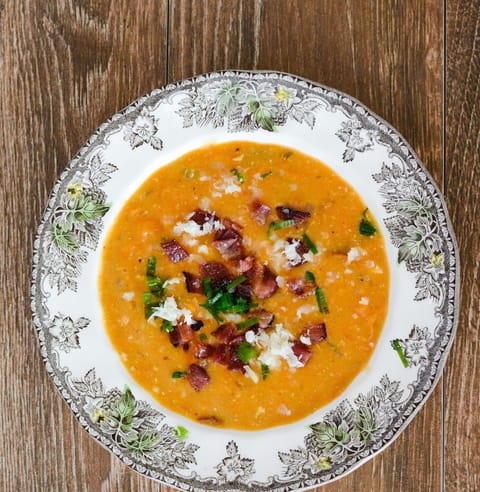 Pumpkin soup in a vintage patterned china bowl